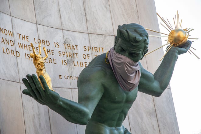 The Spirit of Detroit statue now dons a makeshift mask on April 6, 2020, as Metro Detroiters hunker down during a stay at home mandate due to the Novel Coronavirus.