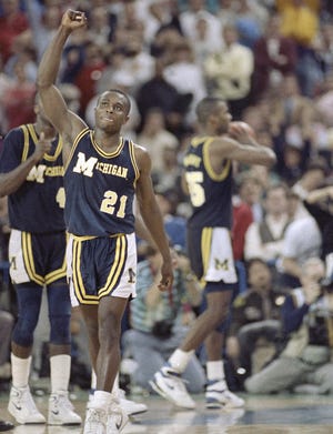 Michigan's Rumeal Robinson celebrates making the first of two free throws with three seconds remaining in overtime against Seton Hall in the NCAA Final Four championship game April 4, 1989 in Seattle. Michigan defeated Seton Hall 80-79.