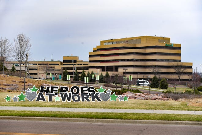 A large lawn sign reads "heroes at work" outside the Avera hospital on Saturday, April 11, in Sioux Falls.