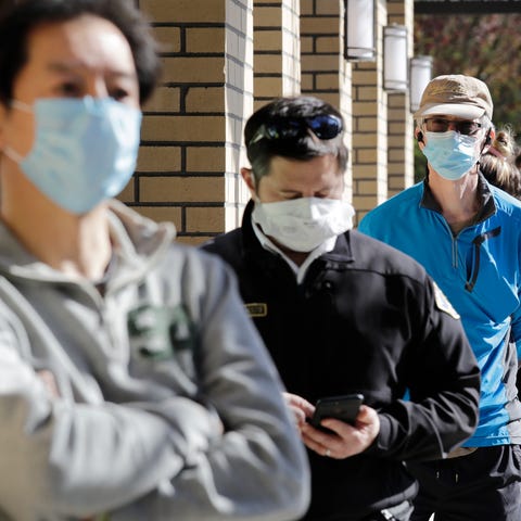 Customers wear a variety of protective masks as th