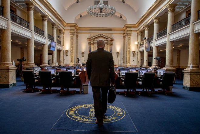 Legislators arrive in the Senate chambers during the last two days of the legislative session at the Capitol building in Frankfort. April 14, 2020