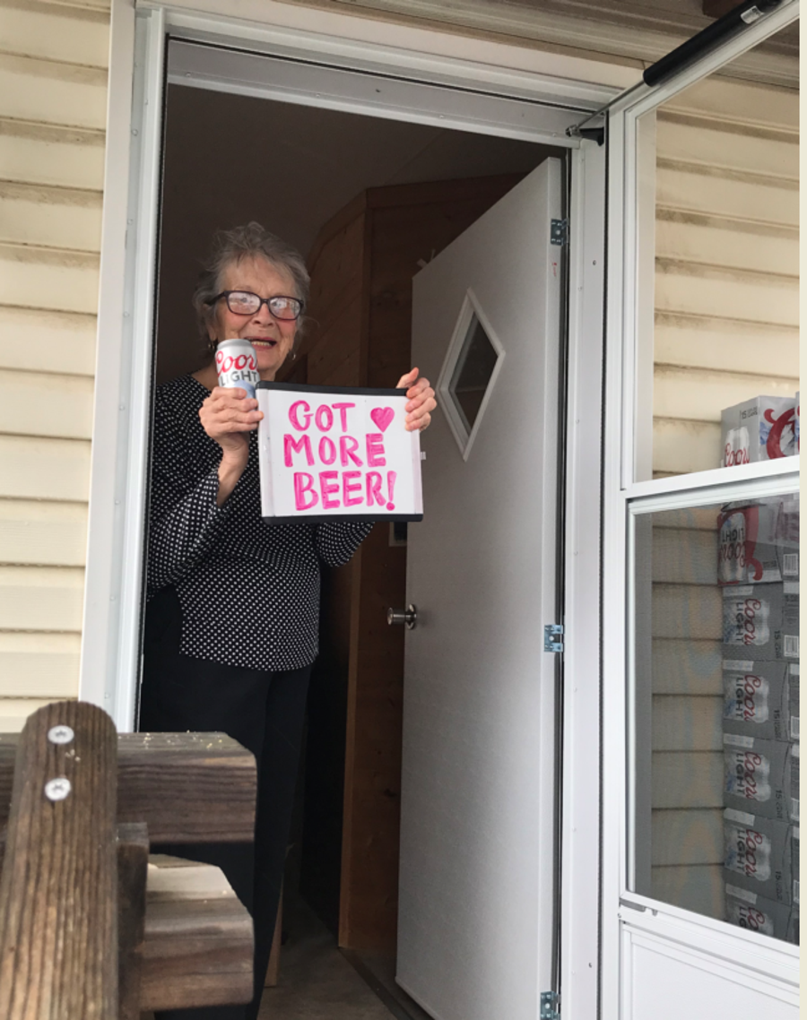 Olive Veronesi, 93, smiles with her cases of Coors Light. Molson Coors gifted Veronesi 150 beers after her plea for more beer went viral amid the coronavirus pandemic.