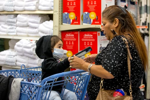 Elsa Martinez, right, shops with her granddaughter, Sophia De La Cruz, 1 1/2, at Ollie's Bargain Outlet on Wednesday, April 15, 2020. The discount retailer had its grand opening on Wednesday.