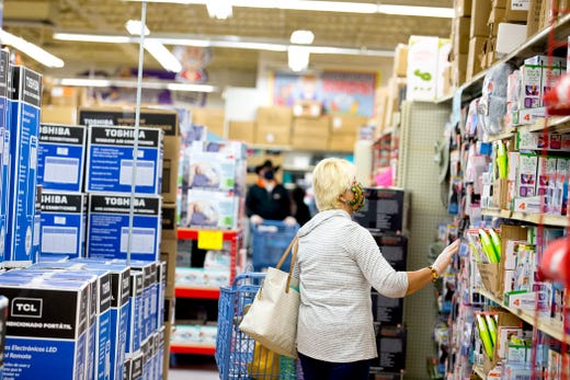 A woman shops at Ollie's Bargain Outlet on Wednesday, April 15, 2020. The discount retailer is allowing 50 people at a time into its stores and has instituted other measures to ensure social distancing and sanitation. Wednesday was its grand opening in Corpus Christi.