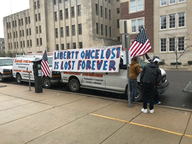 A van is decorated for Wednesday's vehicle protest in front of the Capitol.