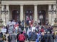Protestors block traffic while others stood on the steps around the Michigan State Capitol building in Lansing on April 15, 2020, to send a message to Gov. Whitmer that the extension of the Stay at Home mandate, in an attempt to lower the Coronavirus infection rate, had gone too far.