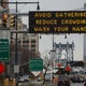 NEW YORK, NY - MARCH 19: A sign warns residents to take steps to contol the outbreak at the entrance to the Manhattan Bridge in Brooklyn as the Coronavirus, COVID19, outbreak continued unabated on March 19, 2020 in New York City. The economic situation in the city continued to decline as more businesses closed their doors and New York weighed a shelter in place order for the entire city. (Photo by Victor J. Blue/Getty Images)