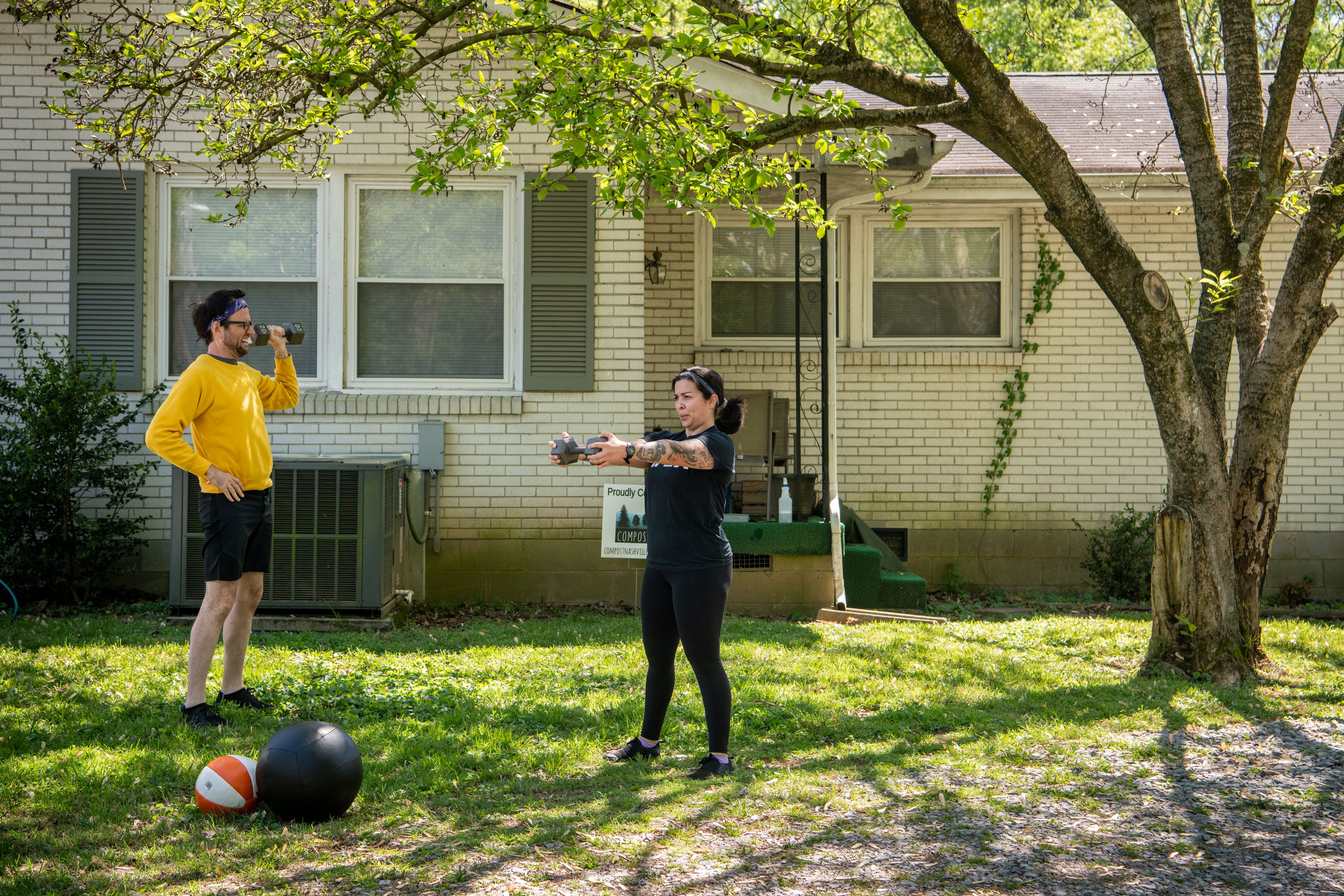 JoAnna Lopez works out in her front yard with her boyfriend, Douglas Showalter, at their East Nashville home on Saturday, April 11, 2020.