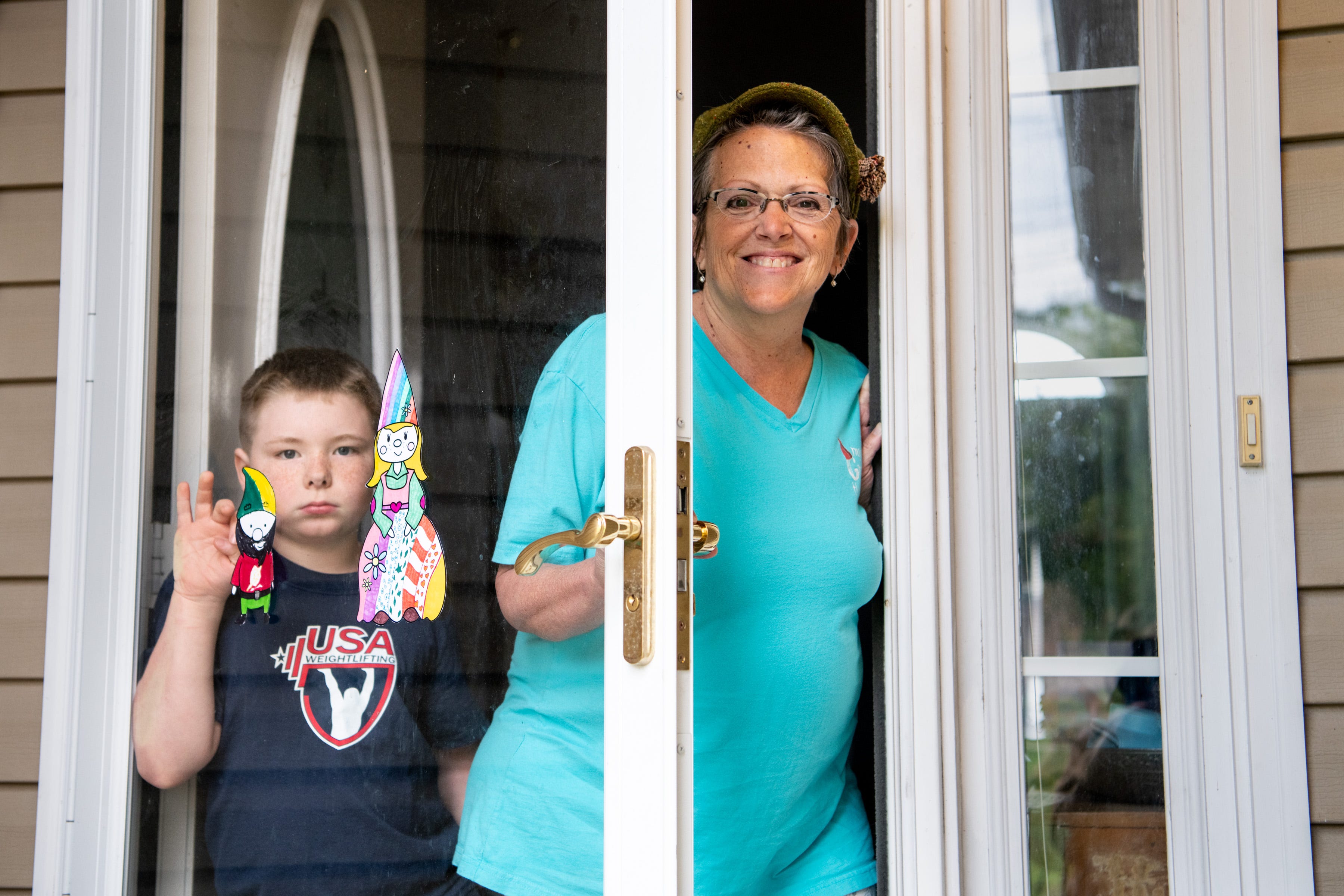 Anne Armstrong stands with her son Atticus at their home in Madison on Thursday, April 9, 2020. The pair founded a company called My Gnome on the Roam.