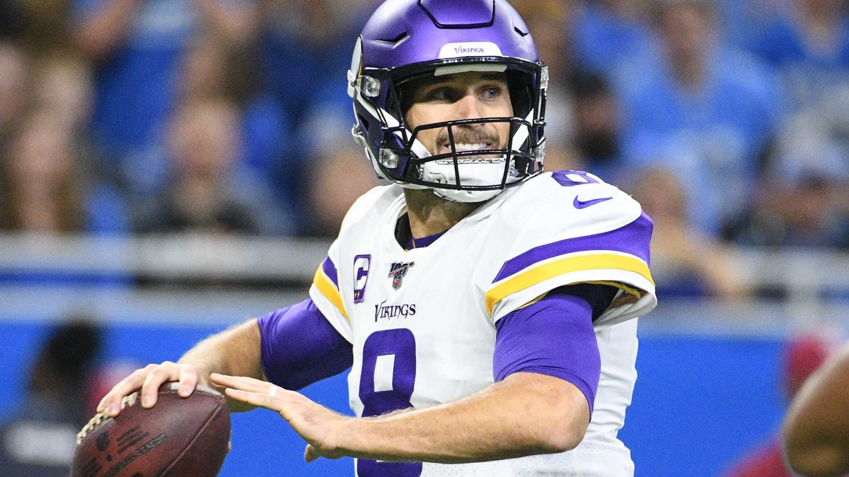 Minnesota Vikings quarterback Kirk Cousins (8) drops back during the first quarter against the Detroit Lions at Ford Field.