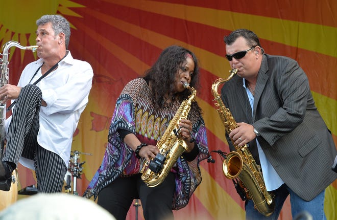 NEW ORLEANS, LA - APRIL 27:  Billy Joel horn section, Mark Rivera, Crystal Taliefero and Carl Fischer perform during the 2013 New Orleans Jazz & Heritage Music Festival at Fair Grounds Race Course on April 27, 2013 in New Orleans, Louisiana.