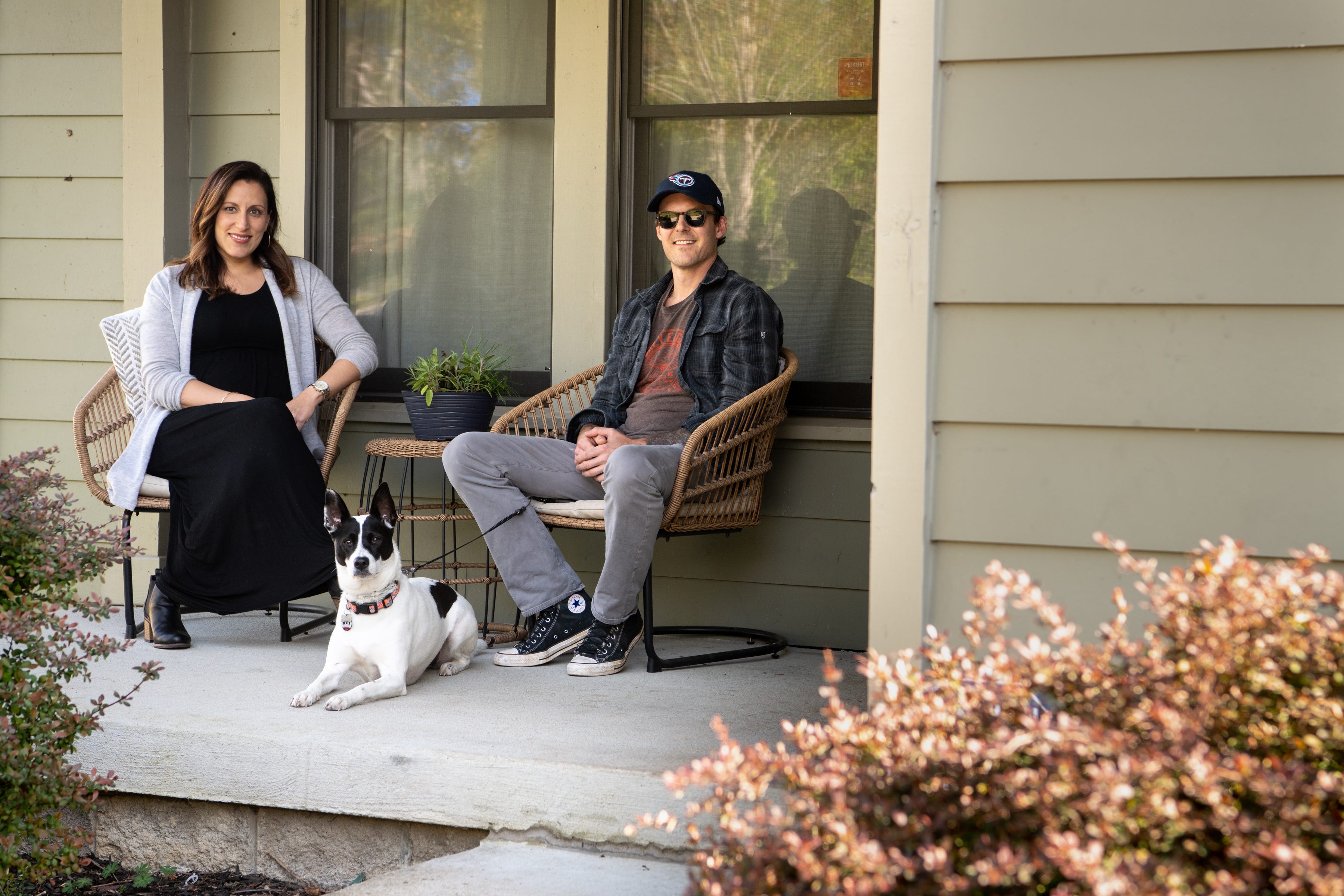 Stephanie Protz, her boyfriend, Dylan Puryear, and their dog, Ruby, pose for a portrait on the porch of their home in Nashville on Wednesday, April 15, 2020.