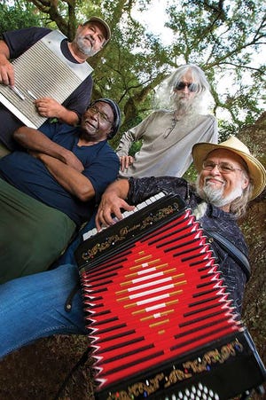 Bass guitarist Jiggs Walker, center, with Zydeco Zoo. Jiggs died on April 3.