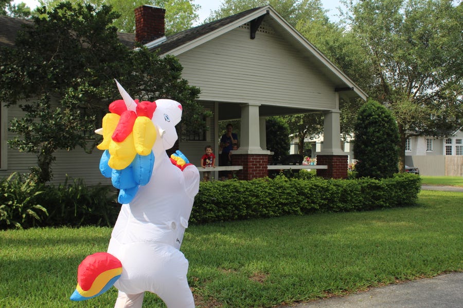 Unicorns are not native to the Old Seminole Heights neighborhood in Tampa, Florida. But it's a quirky place, so Corey Jurgensen's costume isn't totally out of place, either. She tries to brighten the days of her quarantined neighbors.