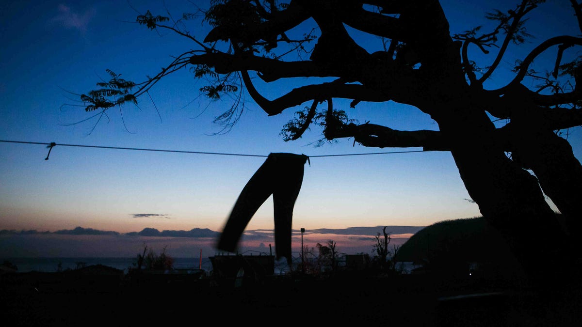 A lonely pair of pants hang in the wind of a high school as the sun sets in Portsmouth, Dominica.