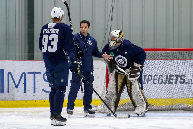 Todd Woodcroft instructs during a Winnipeg Jets practice.