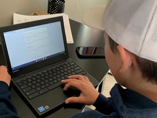 Blake Spies, a seventh-grader at Sabish Middle School, works on school assignments at home since Gov. Tony Evers orders school closed, extending it this week until the end of the year.