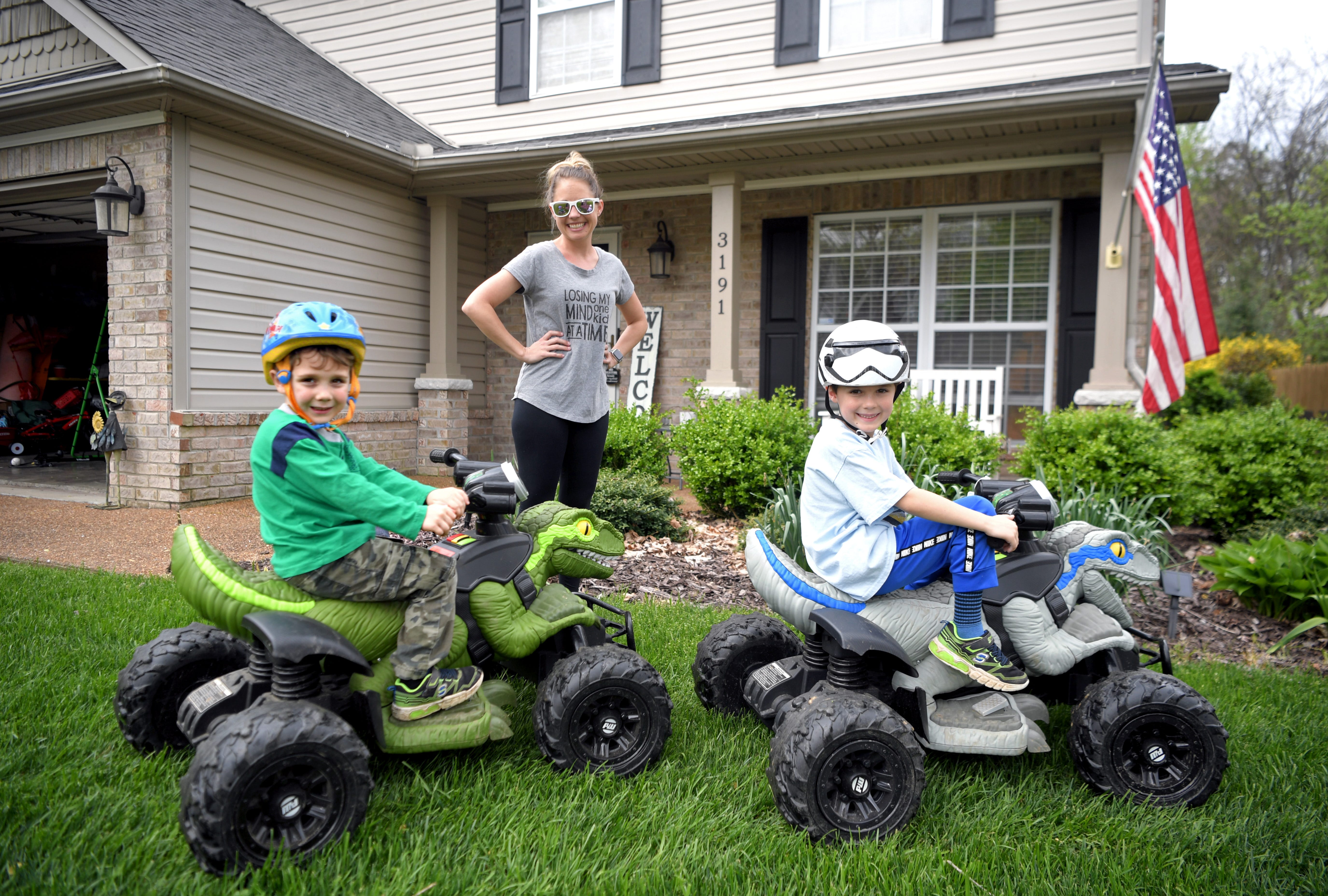 Pearre Creek Elementary School assistant teacher Kelly Jo Thompson and her children, Blair and Milo, play in their Franklin front yard on April 11, 2020.