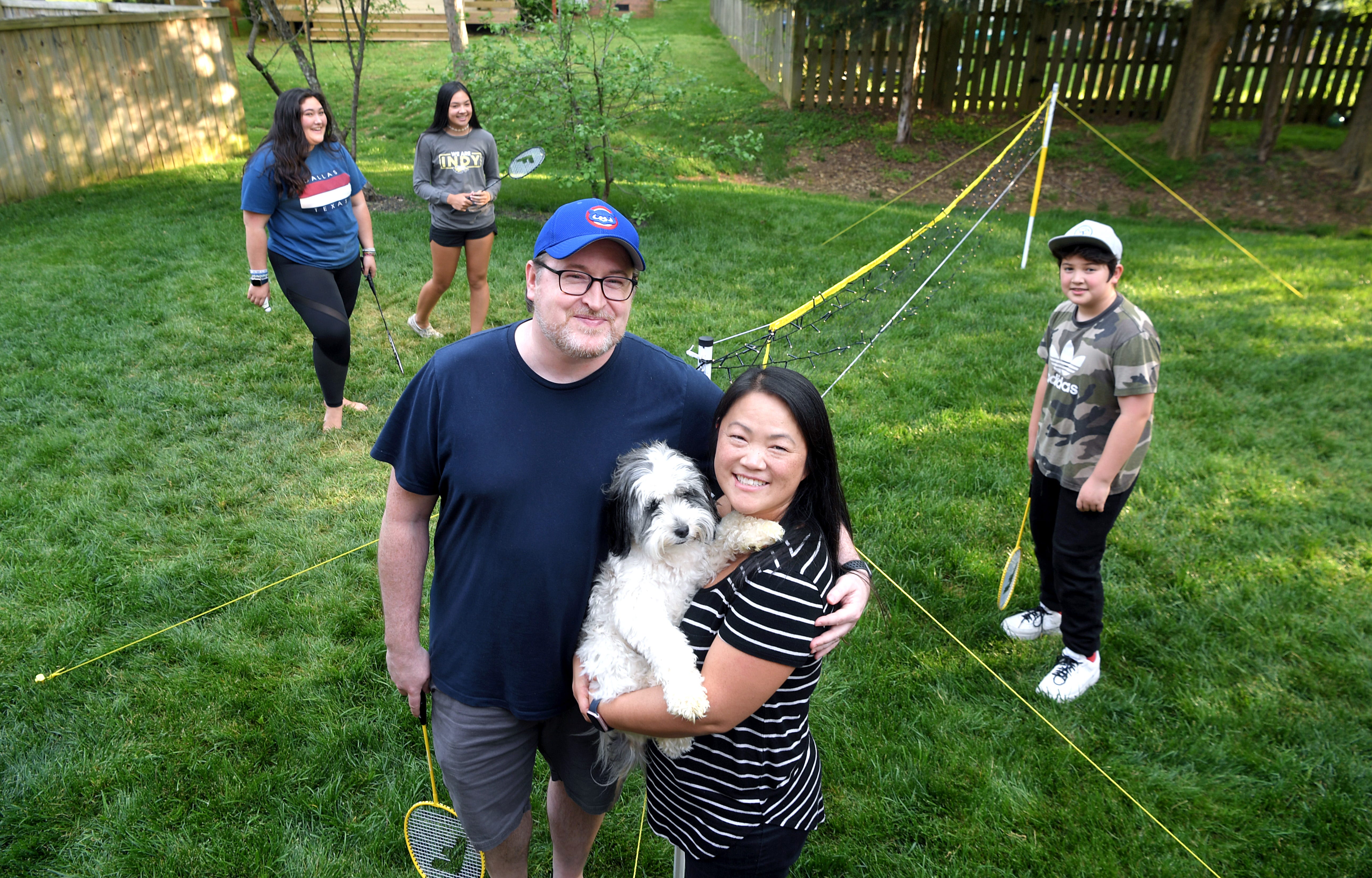 Franklin residents Rusty Mitchell, a product designer at Mercury Intermedia, and Sunny Mitchell, attendance secretary at Legacy Middle School, and their children, Brook, Hanna and Isaac, have turned their backyard into a badminton court.