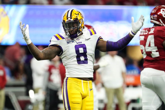 LSU Tigers linebacker Patrick Queen (8) reacts during the second quarter of the 2019 Peach Bowl college football playoff semifinal game against the Oklahoma Sooners.
