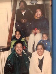 The Gambrell-Fowler family pose for a picture on a staircase. Clockwise from the top are: Keith Gambrell, Paris Fowler, Ross Fowler, Cheryl Fowler, Gary Fowler, and Troy Fowler.