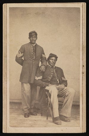 Two unidentified African American soldiers in Union sergeant's uniforms.