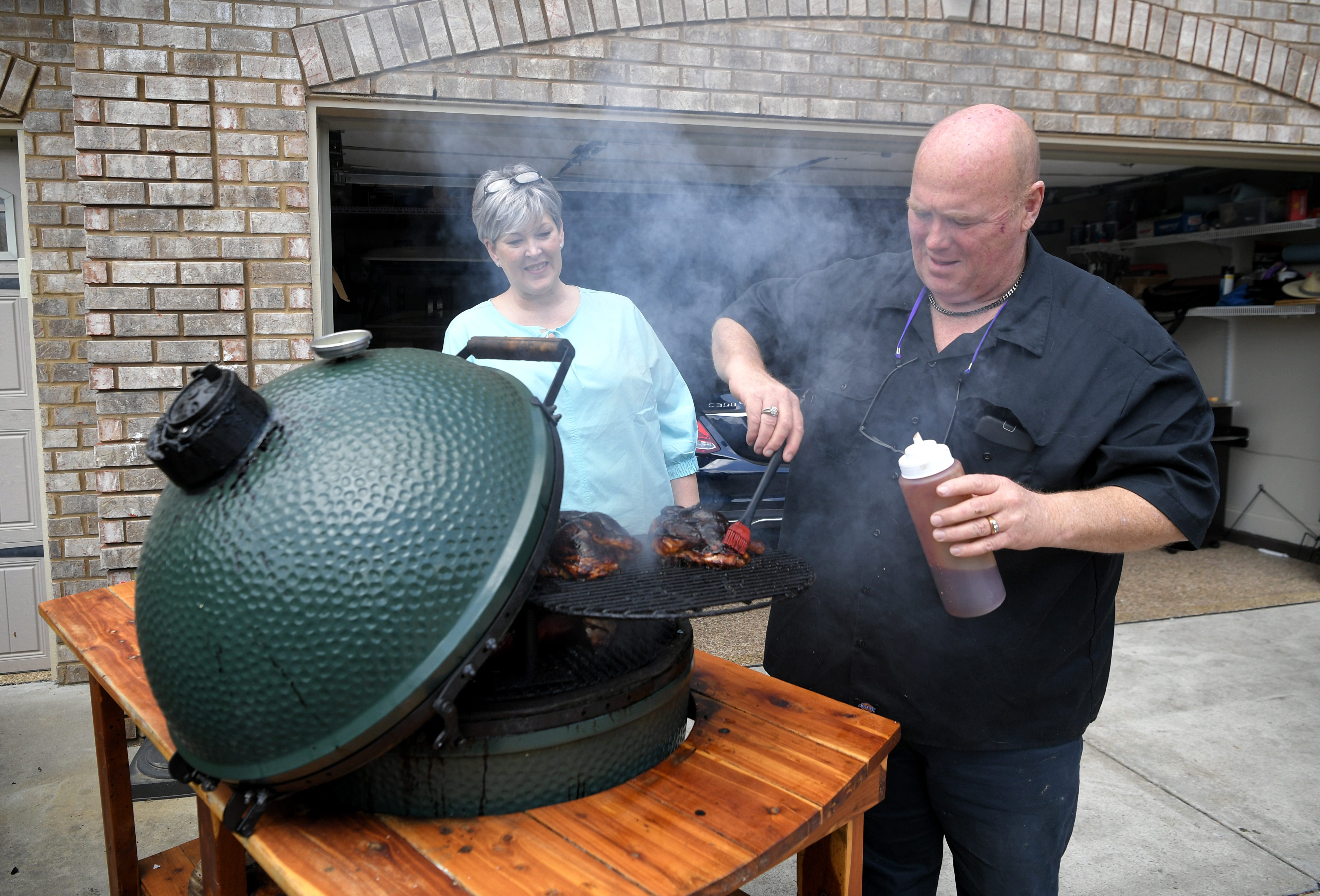 Nelson England, supervisor of operations at Piedmont Natural Gas Co., and his wife, Raven, a real estate agent, have been grilling meals for family, friends and neighbors in their Thompson’s Station driveway.