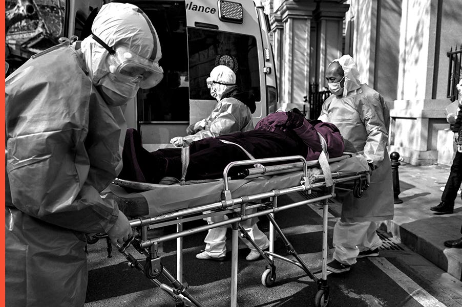 Medical staff in protective clothes are seen carrying a patient from an apartment suspected of having the virus in Wuhan, in Hubei province on January 30, 2020.