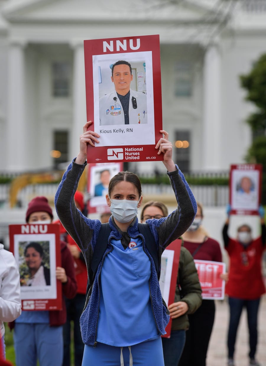 Nurses protest in front of the White House on  April 21 to call attention to the tens of thousands of health care workers nationwide who have become infected with COVID-19 because they lack personal protective equipment (PPE).
