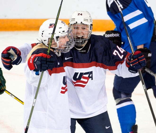 Brighton's Shiann Darkangelo, right, celebrates with Joecelyn Lamoureux-Davidson against Finland during the 2016 women's world hockey championships in Kamloops, British Columbia.