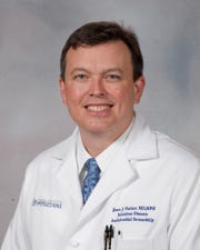 Dr. Jason Parham is director of the University of Mississippi Medical Center's Department of Medicine’s Division of Infectious Diseases.