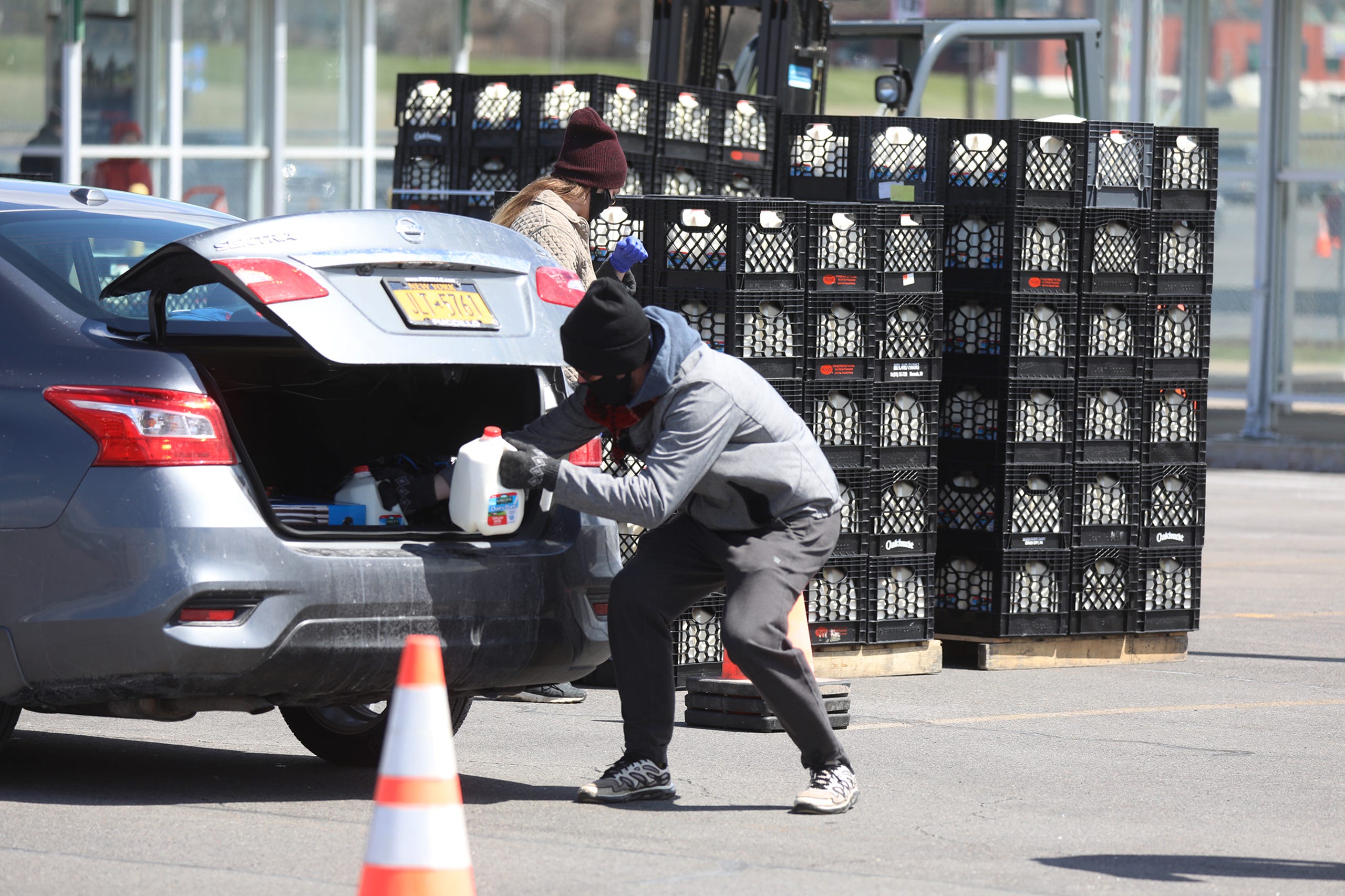 Dairy Farmers of America with help from American Dairy Association North east and Dean Foods processing, gave 5,000 gallons of whole milk to people in the parking lot at Destiny USA in Syracuse, Wednesday, April 21, 2020. Cars, give at a time, pulled forward to get their milk.