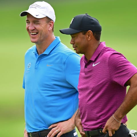Peyton Manning and Tiger Woods at the Memorial pro