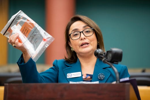 Annette Rodriguez, Director of Public Health for the Corpus Christi-Nueces County Public Health District holds up a COVID-19 test kit during the daily press conference at city hall on Tuesday, April 21, 2020.