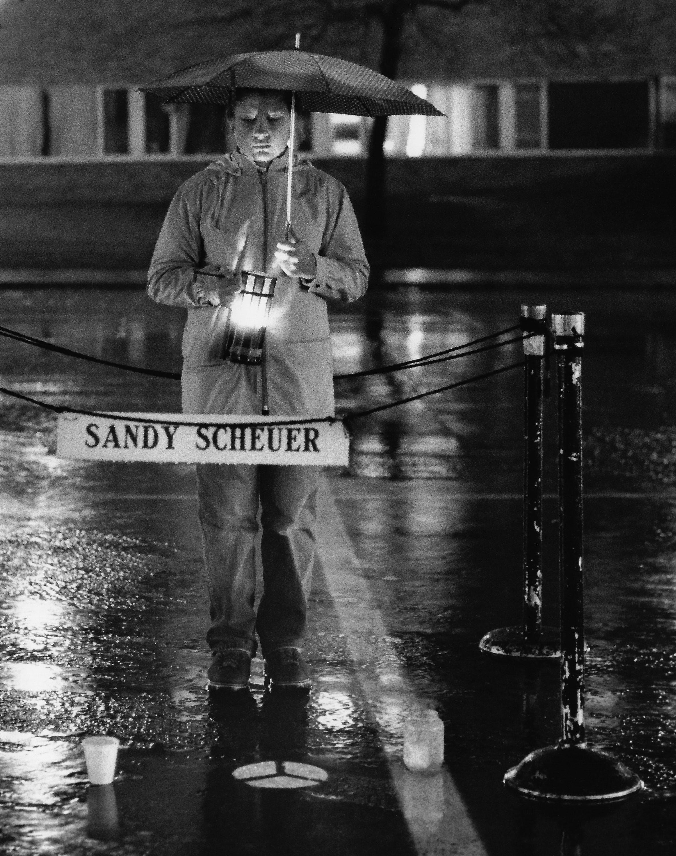 Sandra Ferdinand of Canal Fulton took part May 3, 1984, in the candlelight vigil to commemorate the Kent State University shootings. She is standing in the spot where Sandra Scheuer was shot May 4, 1970, in the Prentice Hall parking lot.