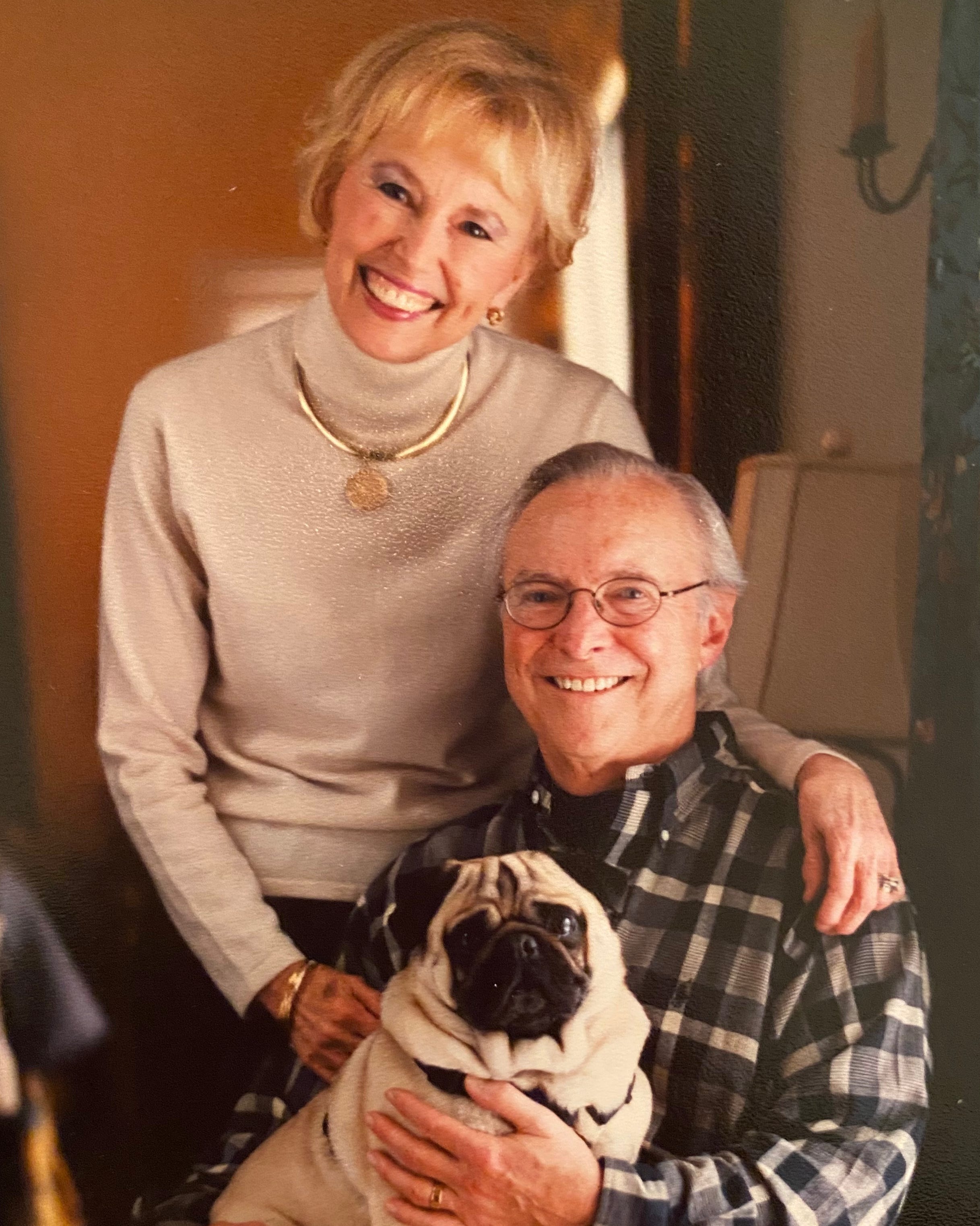 Dr. Charles Edwin Powe, Jr., and Margaret Sanders Powe pose for a photo with their dog Moses. The couple had been married for 58 years before dying four days apart.