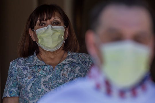 Oscar Holguin tested positive for COVID-19 and was released from Indio County Jail due to his health condition on April 23, 2020. He is photographed at home. His mother, Lucy Holguin, stands behind him at a safe distance. 
