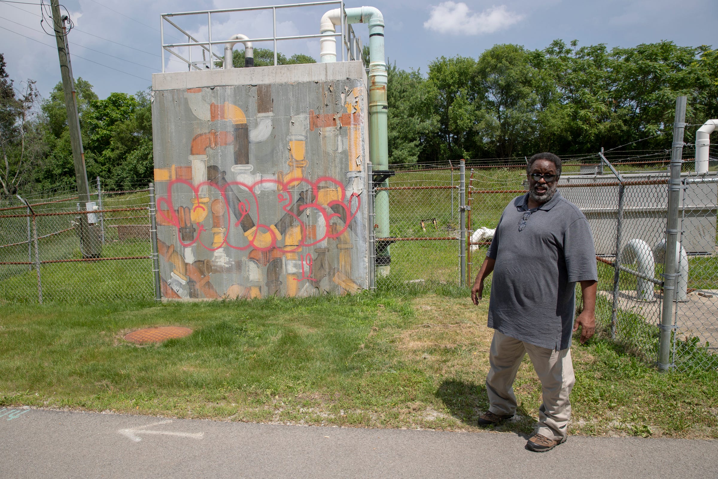 Leon Bates, who lives near Fall Creek, became aware of pollution as a child while playing along it. On Tuesday, July 3, 2019, he's standing by the Monon Interceptor, which receives sewage from Broad Ripple and Nora several miles to the north and pumps it into Fall Creek during rainy overflow conditions.