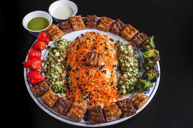 Kebab platter with biryani rice at Hilal Grill restaurant in Phoenix.