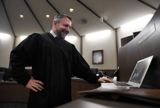 Judge David Stith officiates a wedding via Zoom, Saturday, April 25, 2020, at the Nueces County Courthouse. The district judge marries couples online as a result of coronavirus. 