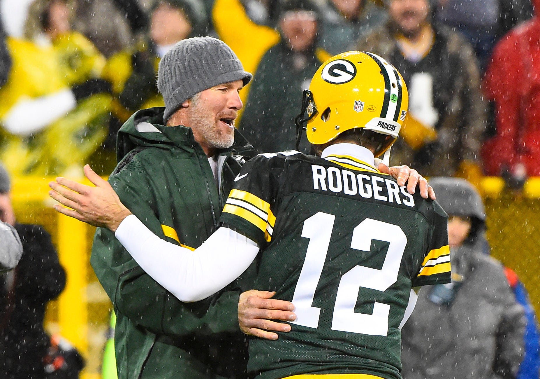 Nov 26, 2015; Green Bay, WI, USA; Green Bay Packers former quarterback Brett Favre hugs Green Bay Packers quarterback Aaron Rodgers (12) at half time for a NFL game against the Chicago Bears on Thanksgiving at Lambeau Field. Mandatory Credit: Mike DiNovo-USA TODAY Sports