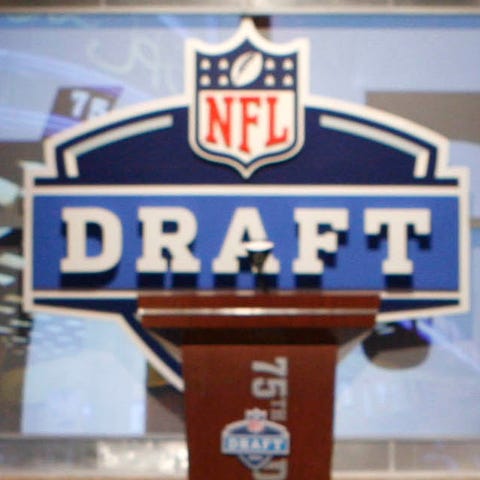 An NFL logo and stage is shown before the first ro