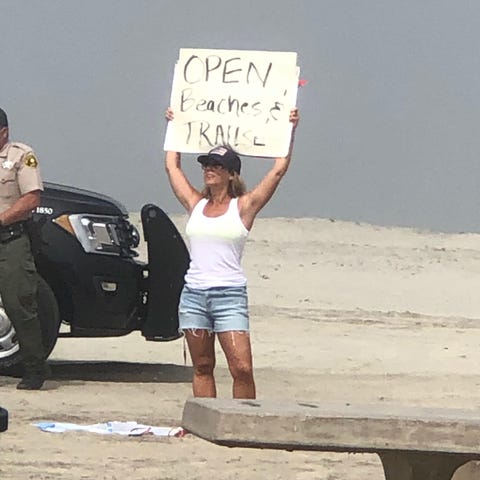 Crista Anne Curtis protests at Moonlight Beach in 