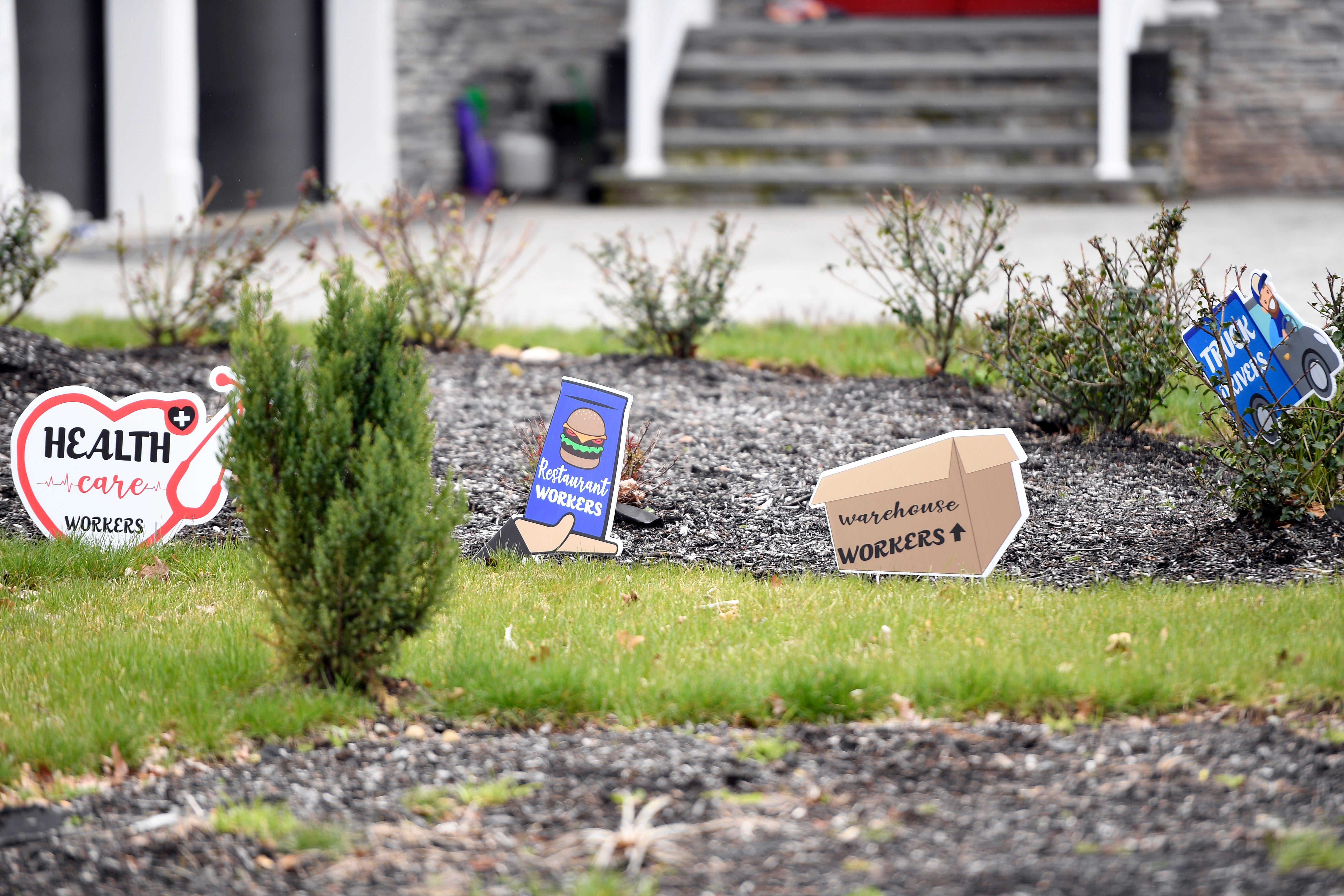 Signs thanking healthcare, restaurant, and warehouse workers sit on the front lawn of Franklin avenue in Wyckoff on Monday, April 27, 2020.