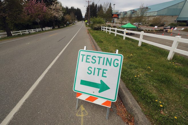 FILE — A sign points the way to the Peninsula Community Health Services COVID-19 testing site at the Kitsap County Fairgrounds in April. County health officials are working to start another large-scale community testing site in late October.
