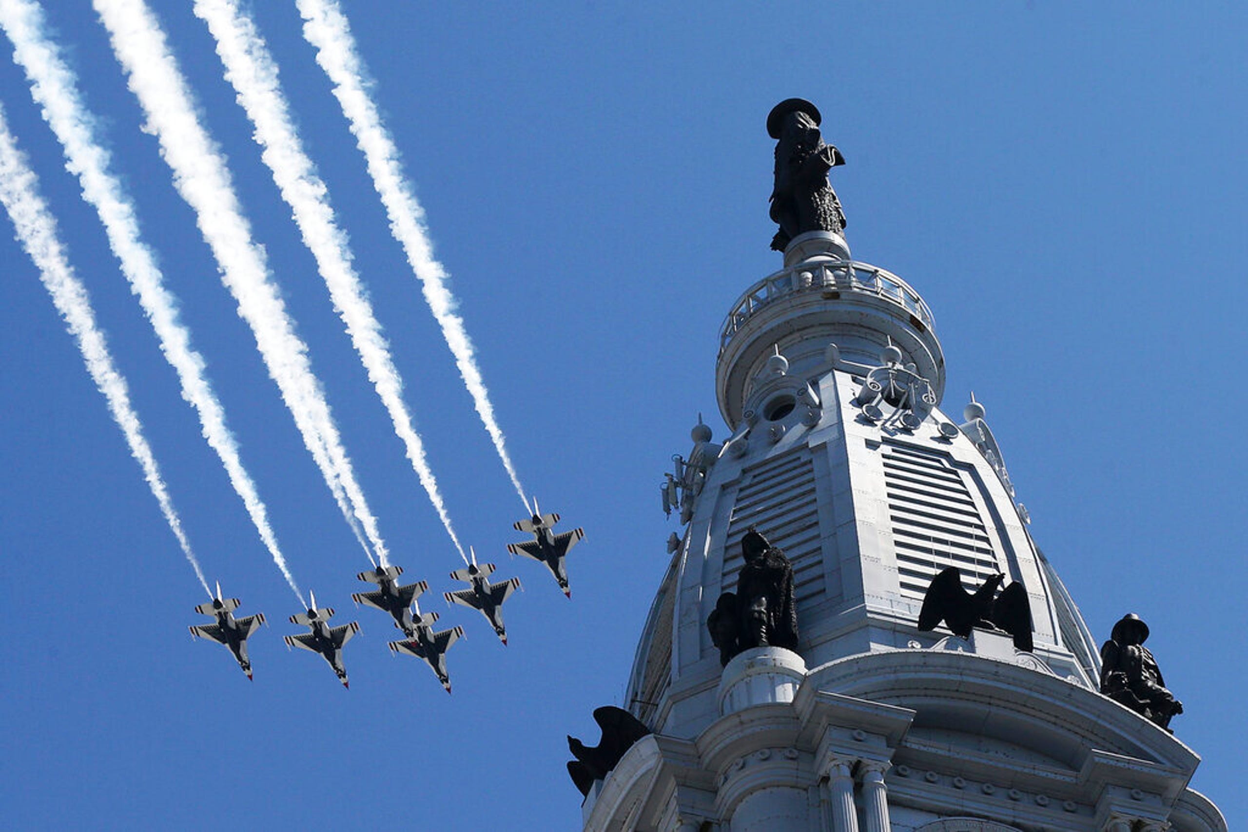 U.S. Navy Blue Angels and U.S. Air Force Thunderbirds fly over the Philadelphia skyline to honor first responders, doctors and nurses on Tuesday, April 28, 2020.