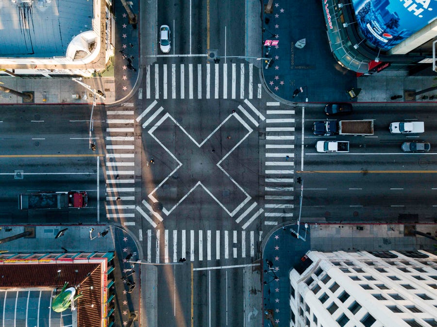 An aerial view at the pedestrian intersection at Hollywood Blvd and Highland Ave during morning rush hour on Monday April 27, 2020 in Los Angeles, California during the coronavirus COVID-19 pandemic.