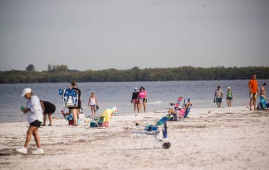 Beachgoers return in waves as Lee County reopens its beaches