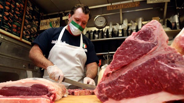 Jason Sabatelle cuts meat at his family's business