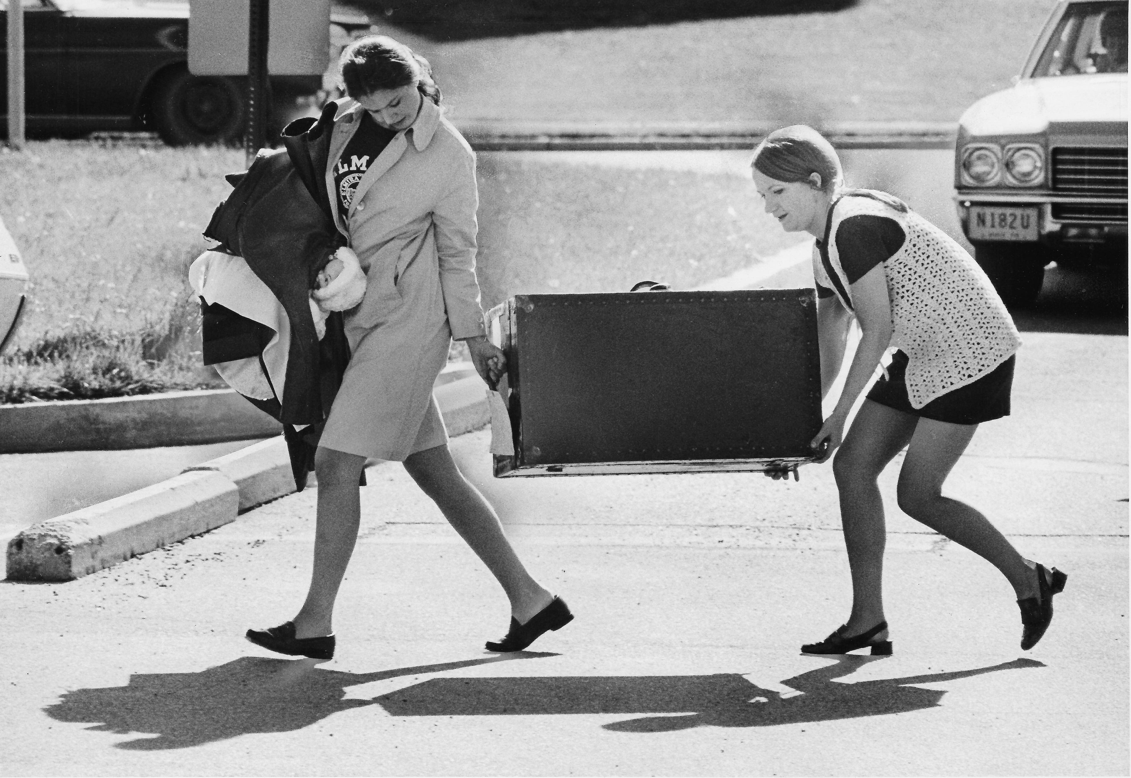 Carolyn Johnson (left), 22, from Chesterland, Ohio, gets some help from Phyllis Gongol, 23, from Canisteo, New York, May 18, 1970. Students returned to campus to pick up their belongings in residence halls as a result of the campus closure following the shootings.